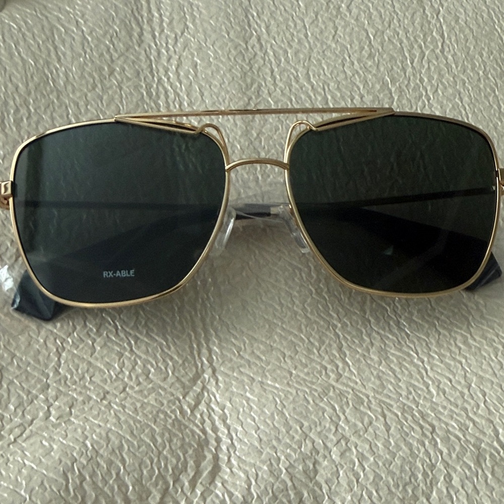 Polaroid Gold Frame Sunglasses with Dark Lenses